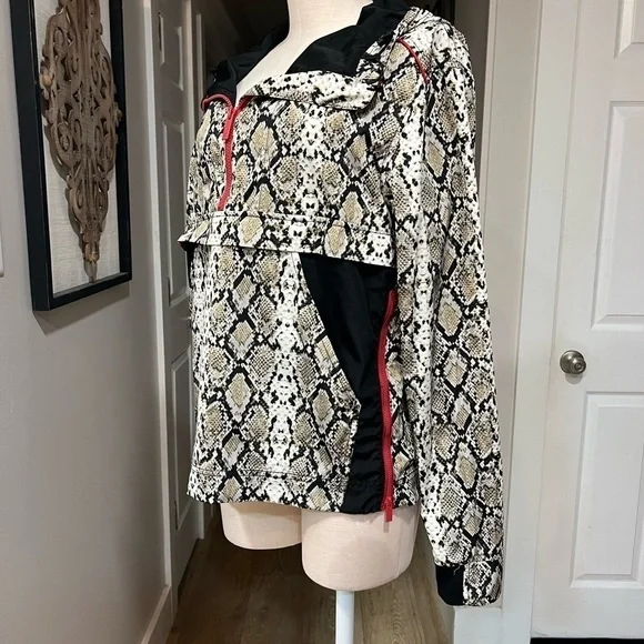 ALALA snakeskin anorak with red accents